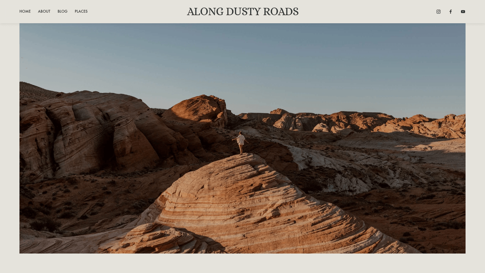 A screenshot of the Along Dusty Roads homepage, one of the best visual travel blog writing examples.