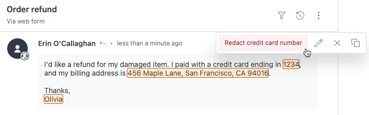 Zendesk's ticket interface displaying orange-highlighted PII suggestions for redaction, including a credit card number and address.